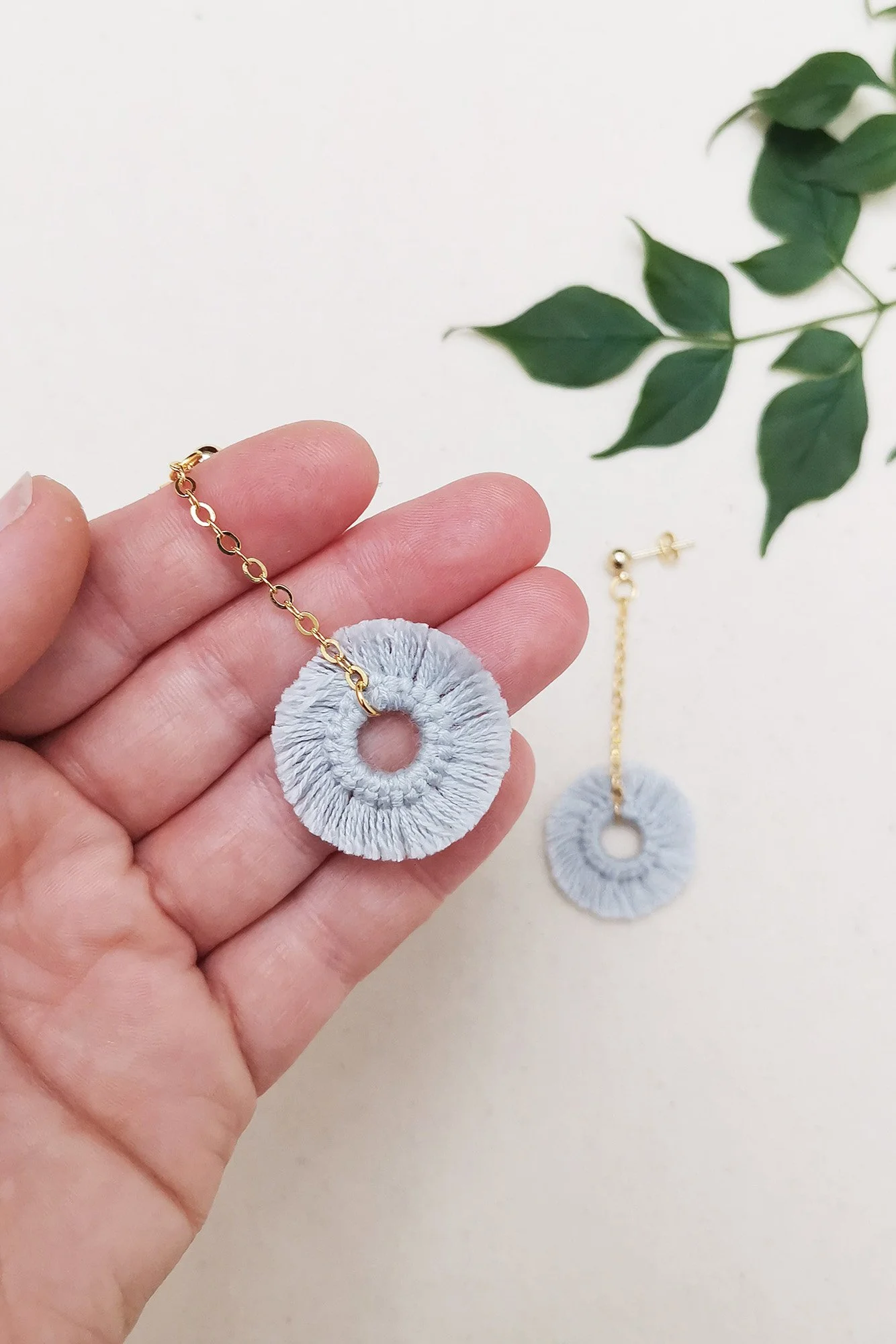 Pom pom online dangle earrings